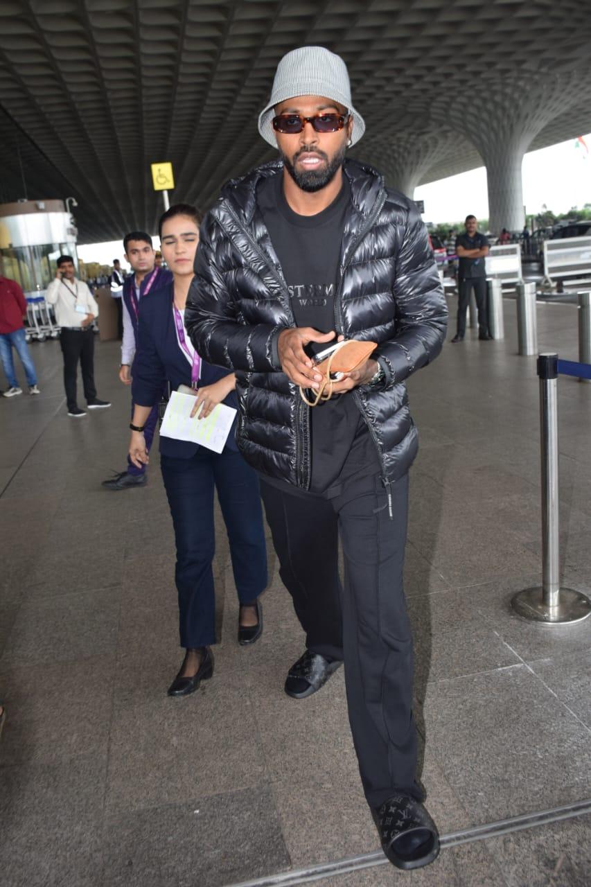 Sporting a trendy athleisure look, he effortlessly combined comfort and fashion. With his iconic accessories and a radiant smile, he showcased his swag and charisma, leaving his fans delighted by his airport appearance.